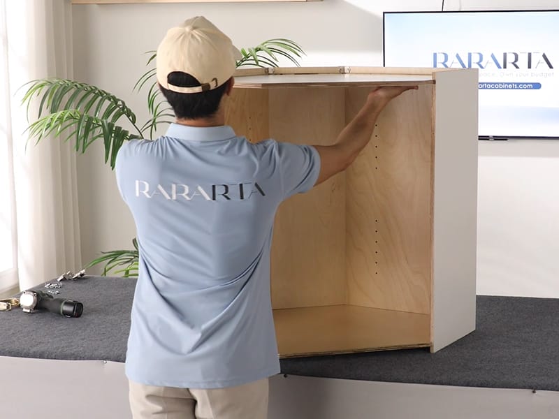 Attach the top and bottom panels of the cabinet