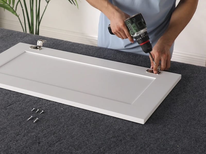 Attach the hinges to the cabinet doors