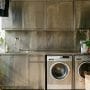 Sleek Stainless Steel Laundry Cabinets on a Sunlit Balcony