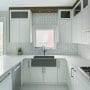 Modern White Kitchen with Gray Farmhouse Sink
