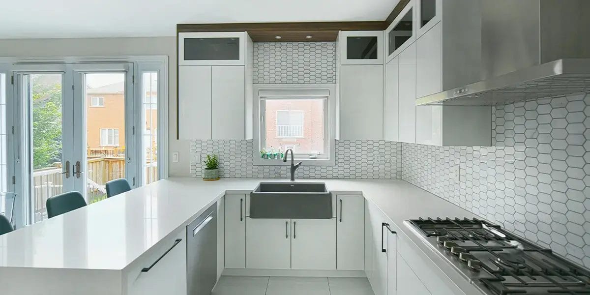 Modern White Kitchen with Gray Farmhouse Sink